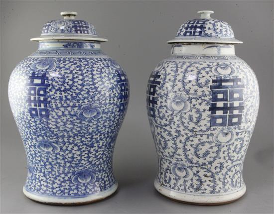 Two large Chinese blue and white vases and covers, 19th century, height 42cm and 43cm